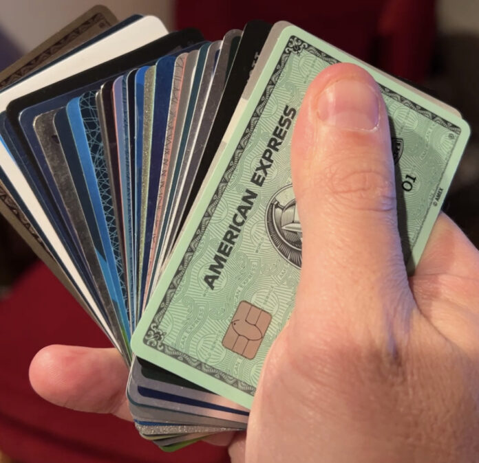 a hand holding a fan of cards